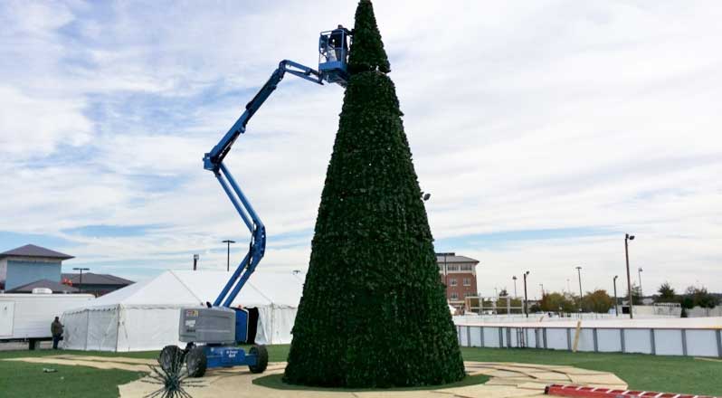 The final section of the tree is put in place.