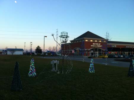 This picture shows the display of the Animated Snowman plus several of our Mini Trees.
